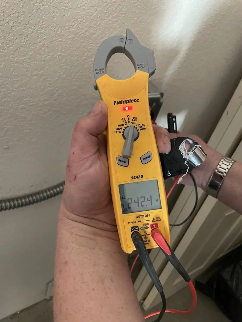 Voltage testing with clamp meter during Generator Installation in Merrimack